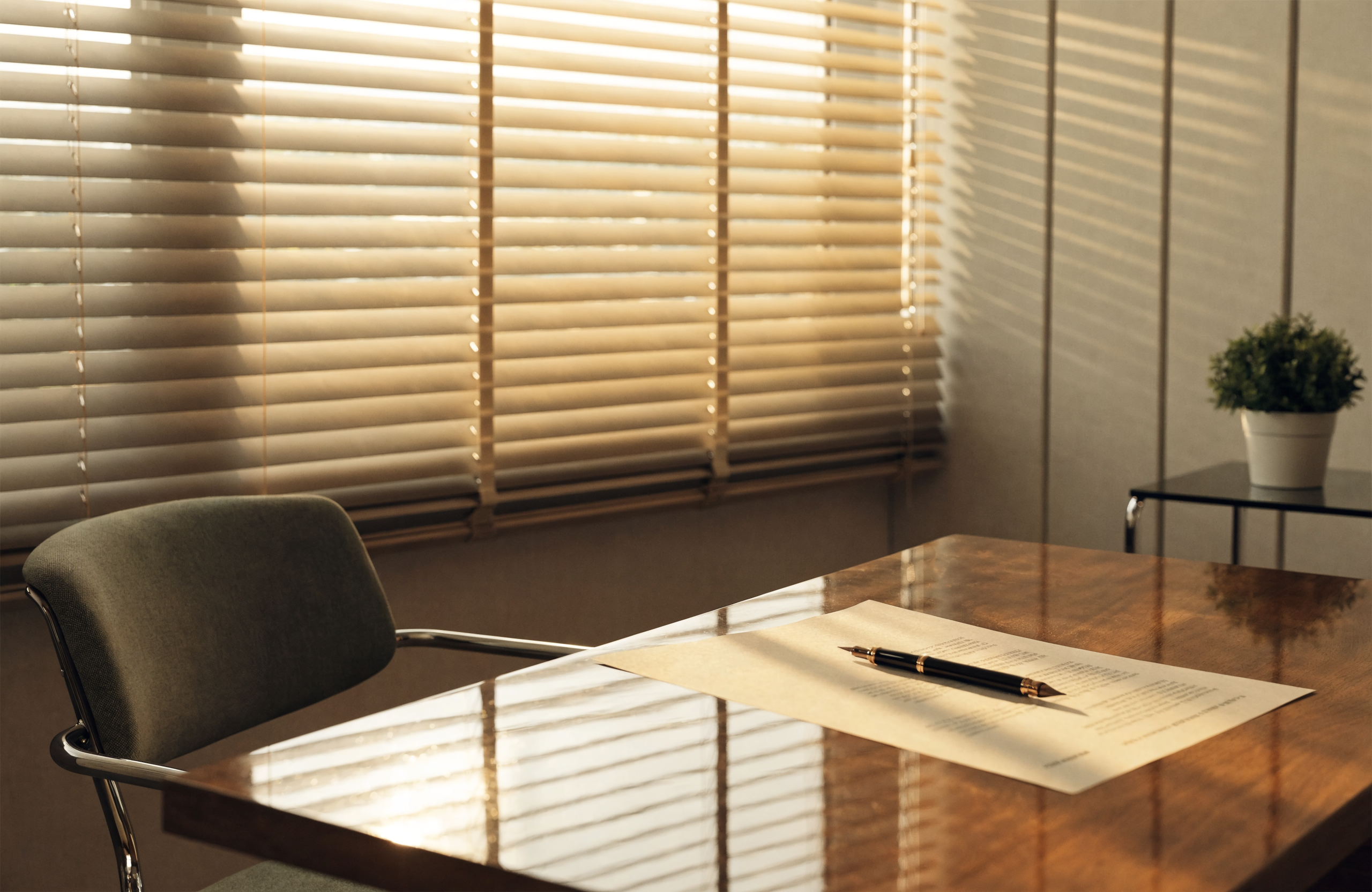 Illustrative image of a will-writing consultation desk with a document and pen