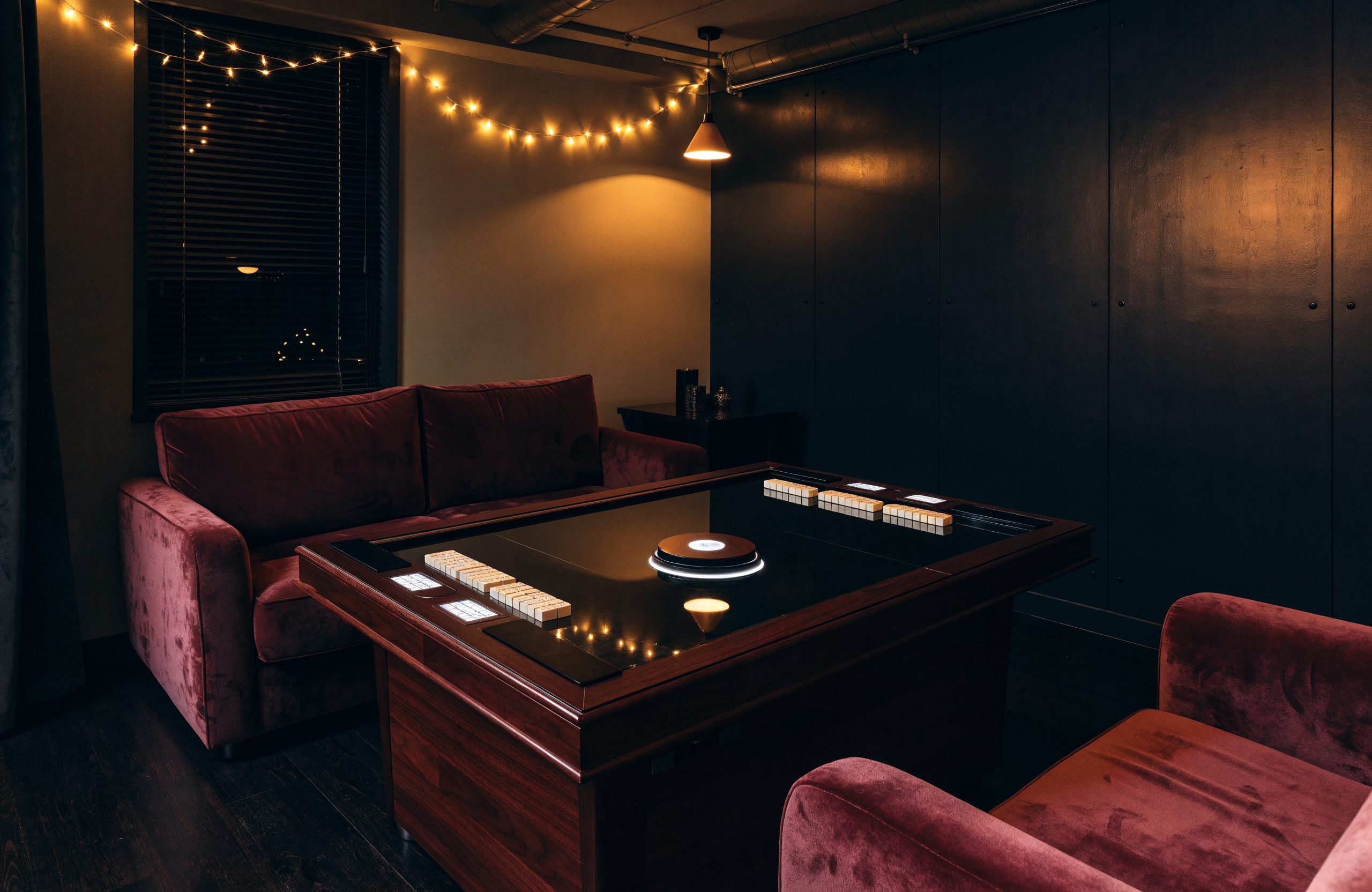 Illustrative image of a small private room with a mahjong table, representing FunHouse SG mahjong experiences in Singapore